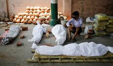 Koronanın dəhşətli növü: meyitlər artıq küçələrdə yandırılır